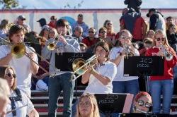 The Pep Band performing in the stands at the football game